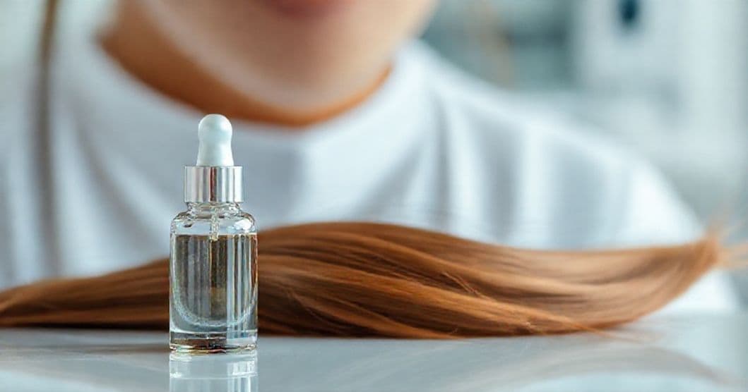 Portrait of a person examining hair health with clinical tools