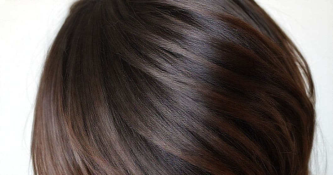 Close-up of hair strands with a soft, hopeful background